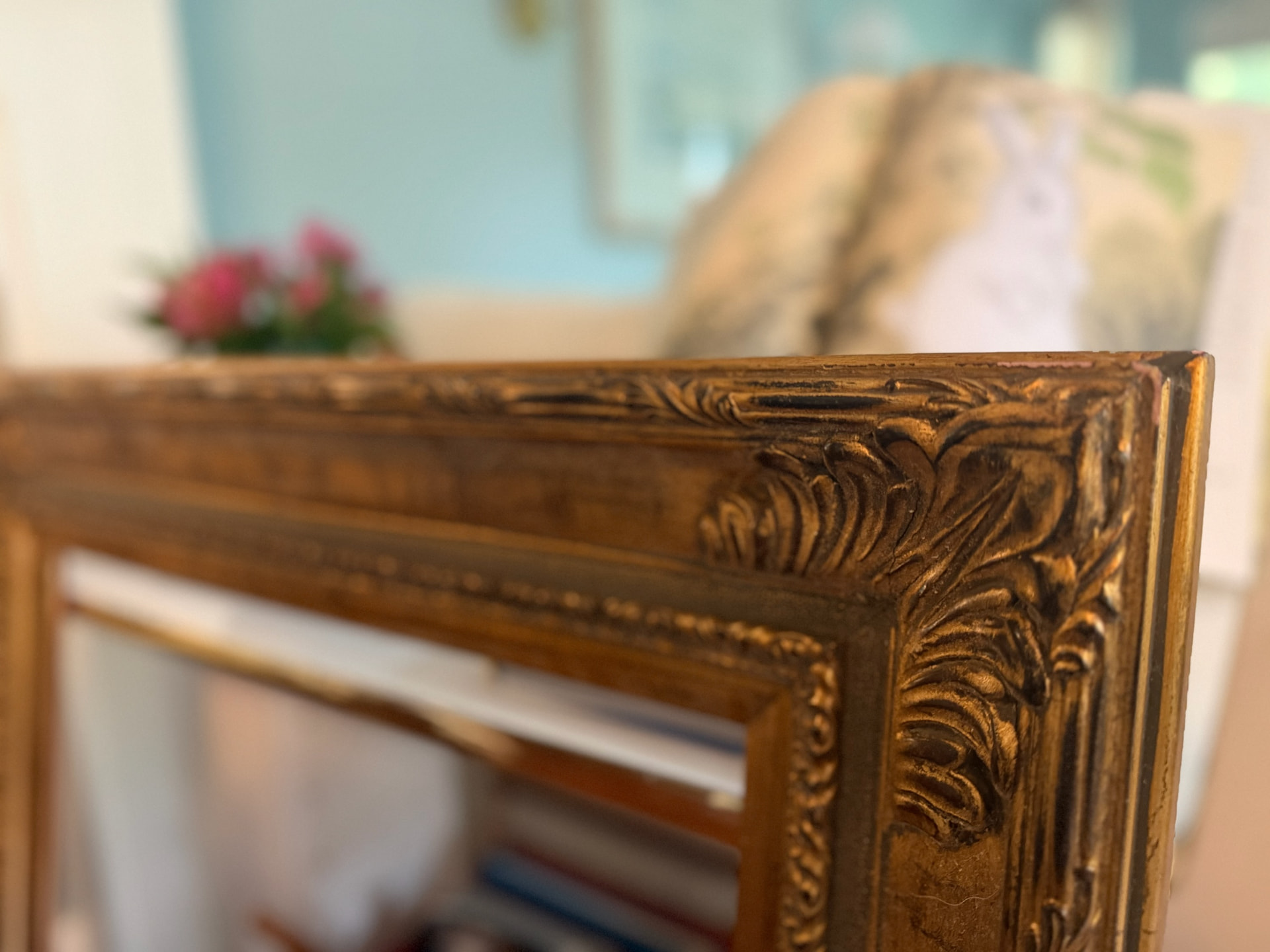 Close-up of the carved corner of a decorative wooden frame